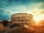 A beautiful shot of the famous Roman Colosseum amphitheater under the breathtaking sky at sunrise